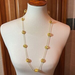 Gold tone and amber-colored resin beaded necklace